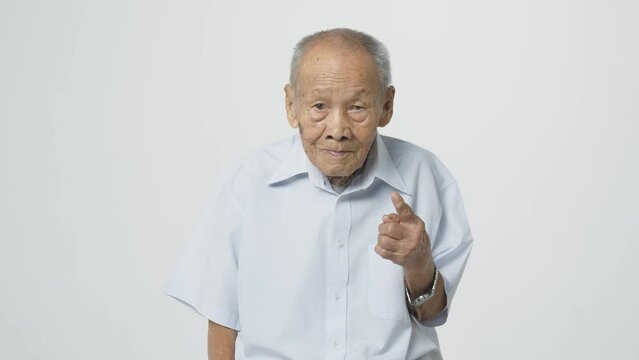 Senior Asian Man In Formal Shirt. A 95 Years Old Guy With A Cataract Eye Problem With A Slight Smile On His Face.