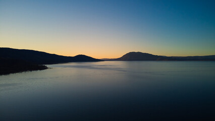 Sunrise on clear lake near the down of Nice California