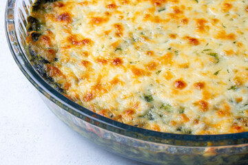 Baked Spinach with cheese delicious Italian food cuisine. Spinach gratin.