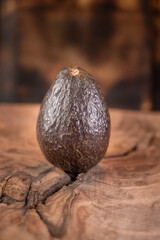 Ripe avocado isolated on wooden background 