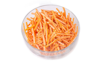 Tomato noodles uncooked on a white background (Turkish name; domatesli eriste)