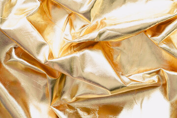 Crumpled gold silk background.