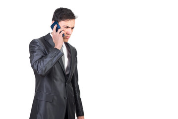 Businessman talking on smartphone and listening to bad news