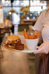 Poke bowls and other gourmet foods, with drinks and sushi on the table,