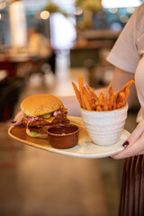 Poke bowls and other gourmet foods, with drinks and sushi on the table,