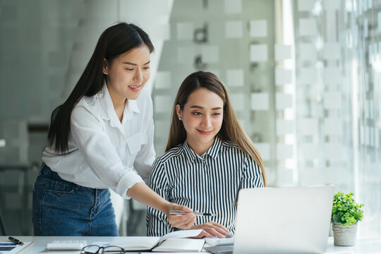 Smiling Asian Hr Insurer Advisor Meeting Applicant At Job Interview Consulting Client About Contract Offer Giving Advice, Happy Diverse Girls Colleagues Interns Students Discussing Paperwork Together