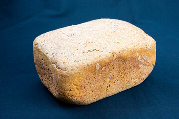 The freshly baked bread on a black background close-up. Making bread. Top view.
