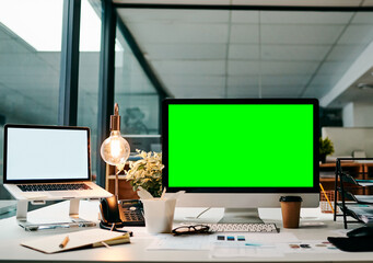 Ready to take this business online. Shot of a desktop computer with a green screen on a table inside of a office during the day.