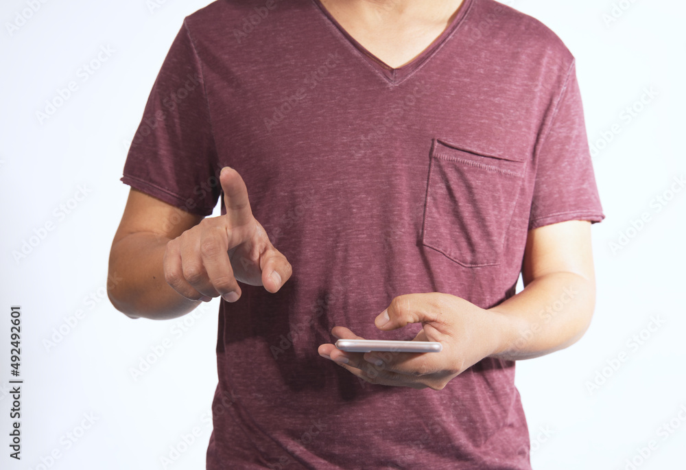 Poster a tall man standing happily using a smartphone On a white isolated background there is a copy space.