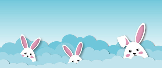 White rabbits with clouds on blue sky background, Holiday illustration for greeting card of Easter’s Day, space for the text. paper cut design style.