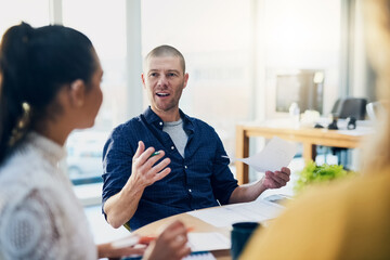 Hes full of great ideas. Cropped shot of a handsome businessman addressing his colleagues during a meeting in their boardroom.