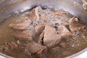 Boiling meat for goulash cooked in a stew-pot in (Turkish name; et haslama, kaynayan et)