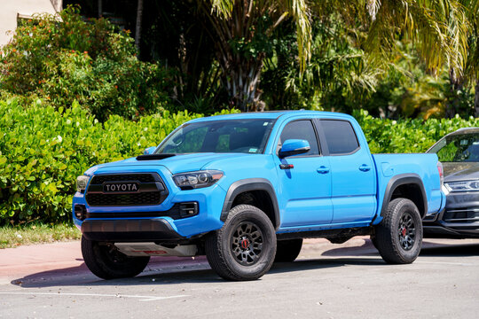 Photo of a new blue Toyota Tacoma 4x4 Pick up truck