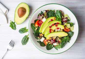 Avocado salad with spinach and pomegranate, diet salad