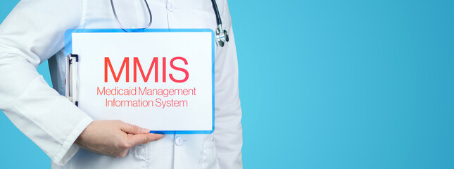 MMIS (Medicaid Management Information System). Doctor with stethoscope holds blue clipboard. Text is written on document. © MQ-Illustrations