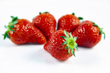 Composition of fresh strawberries on a white background.