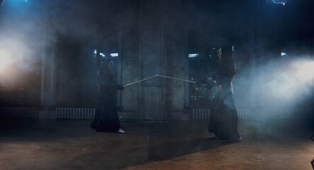 Fototapeta na wymiar kendo duel, indoor fighters