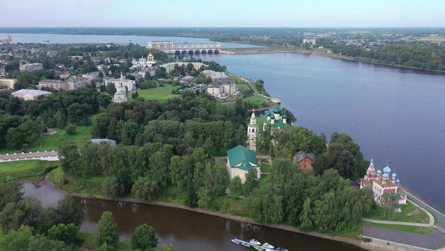 Picturesque aerial view of modern townscape of Uglich overlooking dam on Volga River on summer day, Yaroslavl region, Russia. High quality 4k footage