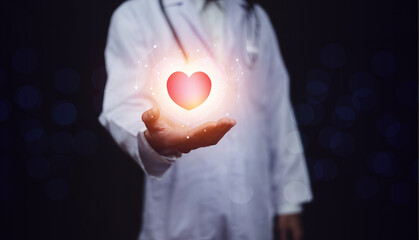 hands holding digital heart on visual screen , health care, love, organ donation,world heart day,...