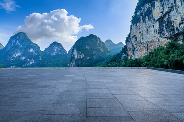 Empty square floor and mountain nature scenery. Road and mountains background.