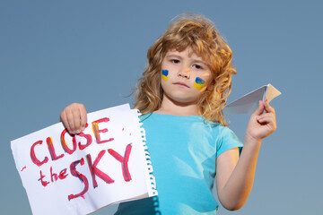 Close the sky over Ukraine banner. No fly zone over Ukraine. World stand With Ukraine.