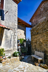 A narrow street among the old stone houses of Rocca Cilento, town in Salerno province, Italy.	