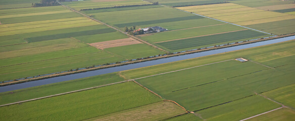 Agricultural landscape of Friesland, one of the northern provinces of the Netherlands - Friesland from above - Local farm