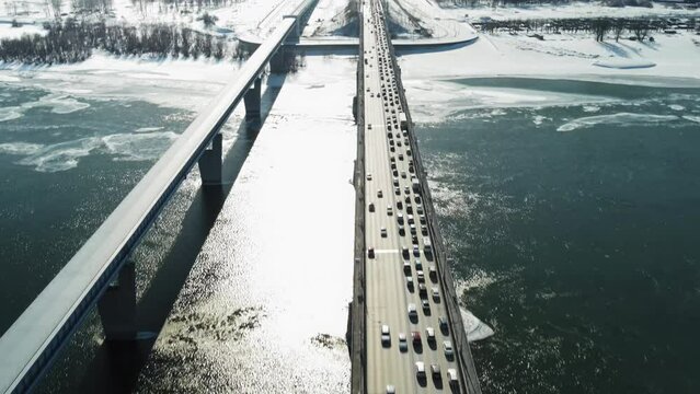 Automobile bridge in Novosibirsk. Machine traffic on the bridge. Traffic jams during winter.