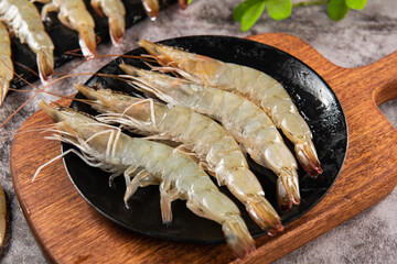 fresh raw white shrimps or prawns on table