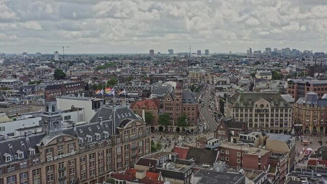 Amsterdam Netherlands Aerial v16 cinematic pull out shot away from busy rokin street overlooking beautiful heritage downtown cityscape across binnenstad and grachtengordel neighborhoods - August 2021