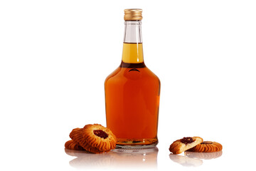 A bottle of brandy and cookies.