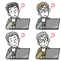 パソコンの前で首をかしげるビジネスマン