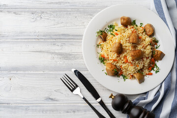 Plate with delicious homemade pilaf with meet