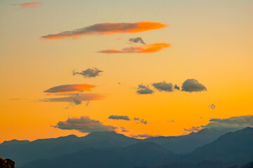 Mountain Silhouettes and Golden Sunset Sky