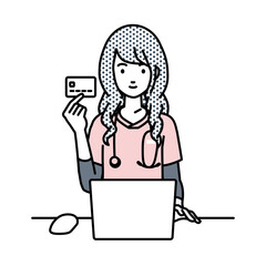 デスクで座ってPCを使いながらクレジットカードを手に持っている看護師の女性
