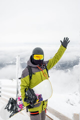 Fototapeta na wymiar man snowboarder on the top of the chopok mountain