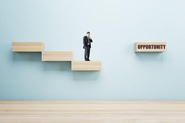 Male with abstract crisis management gap on blue wall background. Business obstacle and recovery concept.