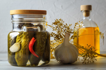Pickled cucumbers in a jar.