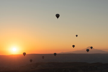 Hot air balloons in the sky during sunrise. Travel, dreams come true concept