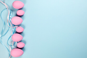 Pink Easter eggs on a blue background