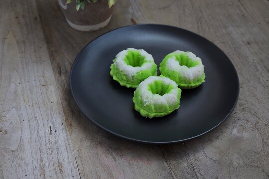 Puteri Ayu is a popular Asian "kuih" with green in color and white coconut toppings