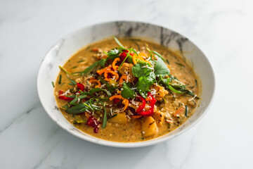 vegan thai vegetable curry with fresh chili and herbs, healthy plant-based food