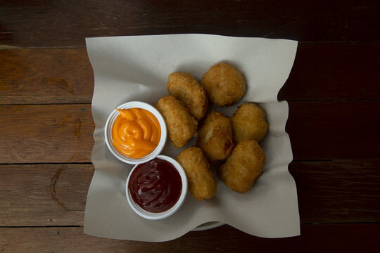 Chicken nuggets are small pieces of chicken, breaded or battered and fried or baked, and are a popular fast food dish.