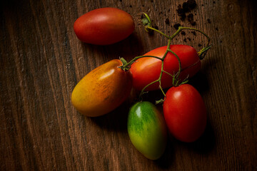 San Marzano tomatoes lying on wooden surface