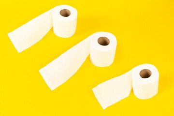 toilet papers on yellow background
