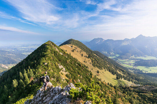 Male hiker admiring view from summit of Aiplspitz mountain