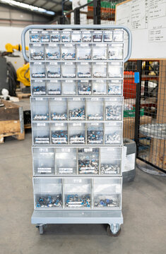 Nuts and bolts in storage boxes at factory