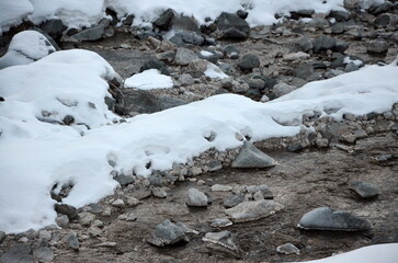Photos of the snowcapped Dolomites during a winter trip and the small villages in the mountain valleys on a sunny, cold day