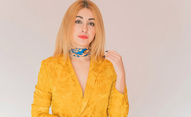 Style for ladies, women in yellow jacket and blue scarf, fashionable concept 