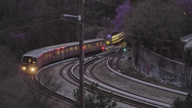 A Train Emerges Out Of A Tunnel At Night
